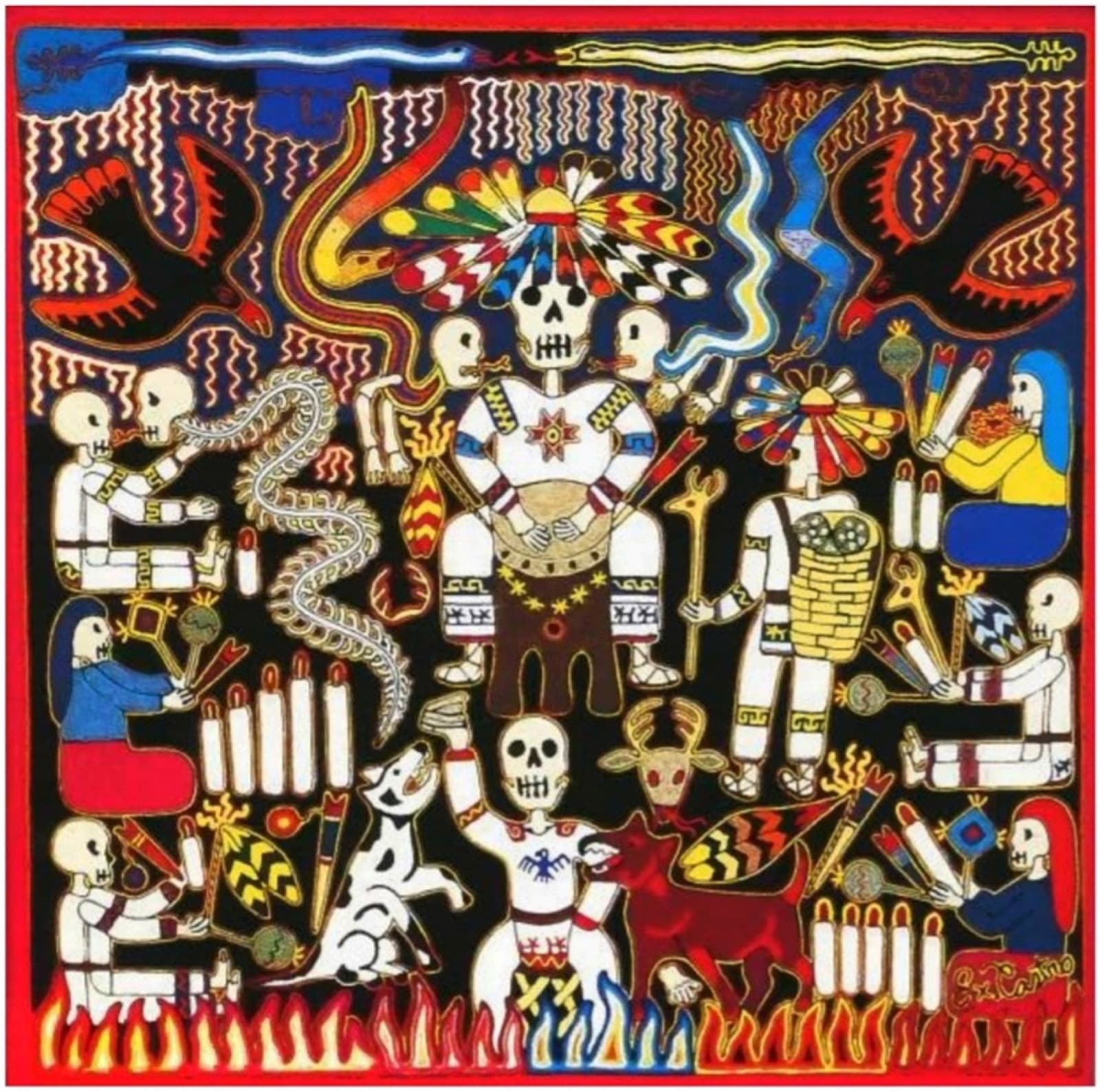 Cuadro de estambre wixárika que representa a un chamán o mara'akame en una ceremonia nocturna con velas y figuras rituales